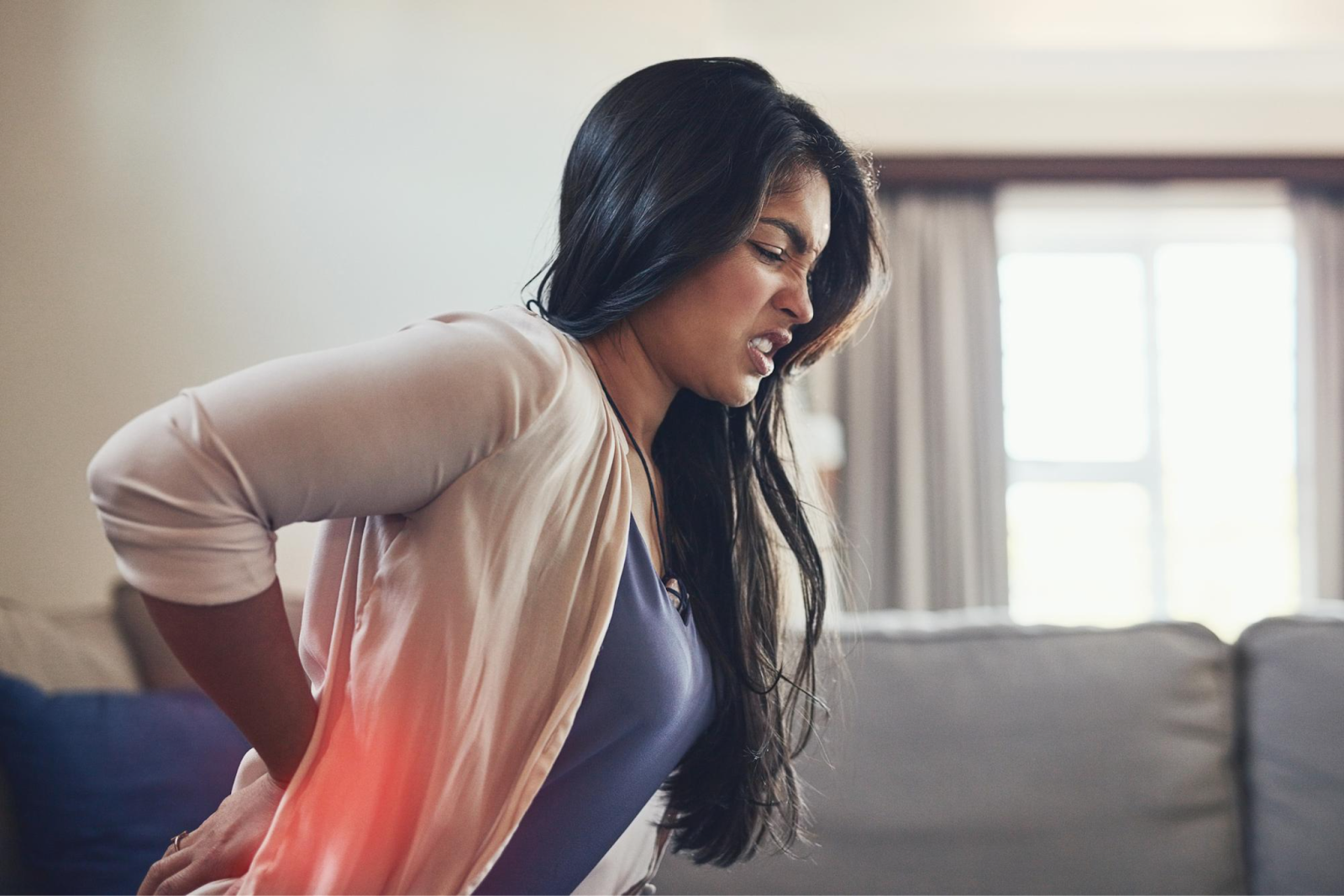 Woman suffering from acute pain