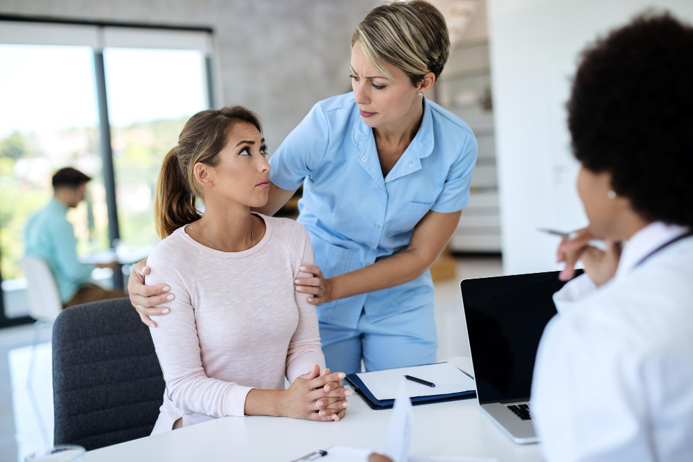 Nurse talking to anxious patient